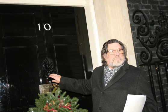Ricky Tomlinson serving the petition at 10 Downing Street, Monday 16th December 2013.