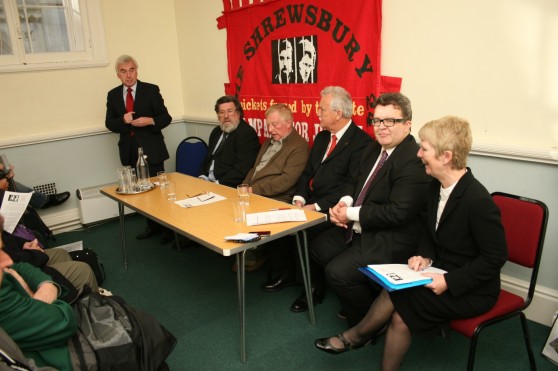 Panel John McDonnell MP addresses the meeting alongside other members of the platform, Ricky Tomlinson, Eddie Roberts, Terry Renshaw, Tom Watson MP and Eileen Turnbull.